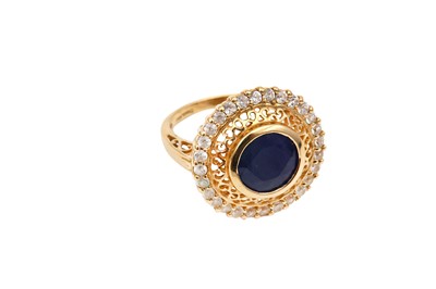 Lot 3 - A sapphire and imitation diamond cluster ring,...