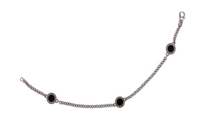 Lot 74 - An onyx bracelet, by Bulgari The curb-link...