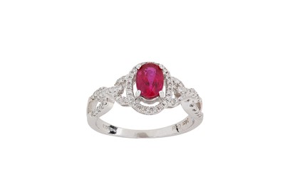 Lot 296 - A ruby and diamond ring The oval-cut ruby,...