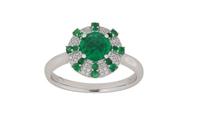 Lot 277 - An emerald and diamond ring The circular-cut...