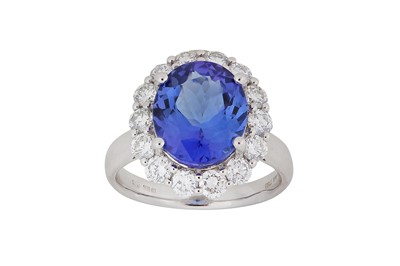 Lot 278 - A tanzanite and diamond ring The oval-cut...