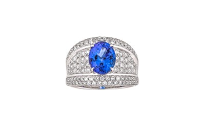 Lot 305 - A tanzanite and diamond ring The oval-cut...