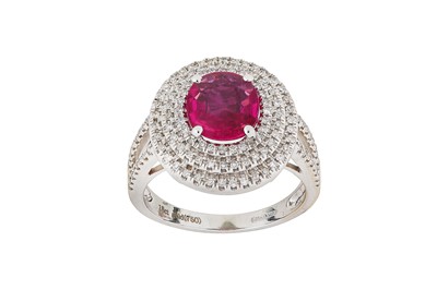 Lot 291 - A ruby and diamond ring The cushion-shaped...