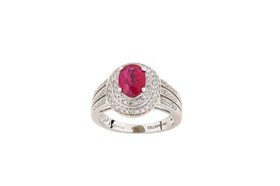 Lot 298 - A ruby and diamond ring The oval-cut ruby,...