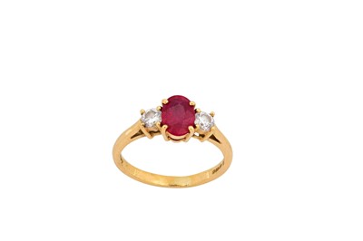 Lot 42 - A ruby and diamond three-stone ring, by...