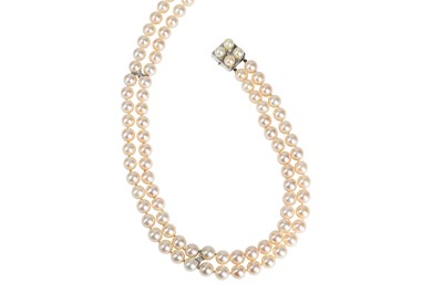 Lot 51 - A cultured pearl and diamond necklace The two...