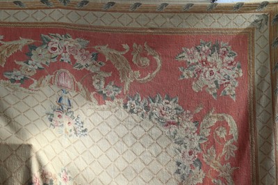 Lot 448 - A tapestry wall hanging with floral designs on...