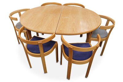 Lot 313 - A 1980s Danish beech dining table and chairs...