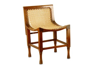 Lot 424 - A low Thebes style stool with shaped back and...