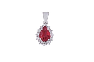 Lot 50 - A ruby and diamond cluster pendant The...