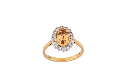 Lot 237 - A topaz and diamond cluster ring The...