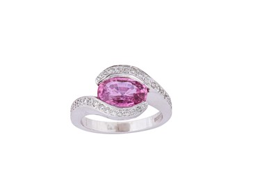 Lot 215 - A pink sapphire and diamond dress ring The...