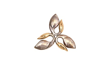 Lot 23 - A silver and 9 carat gold brooch, by Brett...