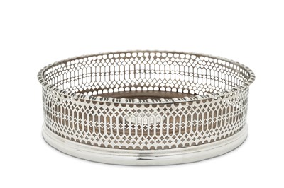 Lot 493 - A George III sterling silver wine coaster,...