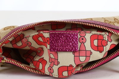 Lot 214 - Gucci Supreme Wristlet Pochette, metallic pink...