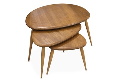 Lot 368 - A 1970's Ercol light elm nest of three pebble...