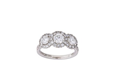 Lot 162 - A diamond three-stone ring The centre...