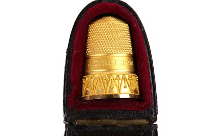 Lot 141 - A cased Victorian 15 carat gold thimble,...