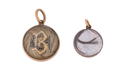 Lot 12 - Two rock crystal and enamel mourning lockets,...