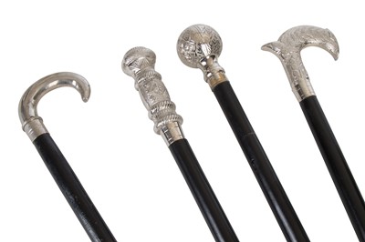 Lot 342 - A collection of four chrome handled walking...