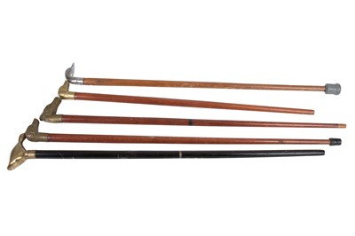 Lot 347 - A collection of four brass and one chrome...
