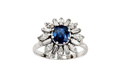 Lot 154 - A sapphire and diamond cluster ring, 1985 The...