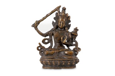Lot 186 - A small Tibetan bronze figure of Manjusri,...