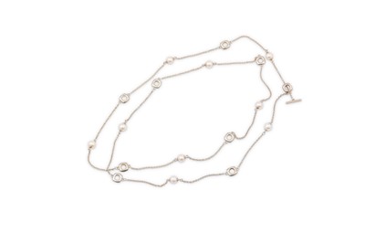 Lot 56 - A cultured pearl and silver longchain, by...