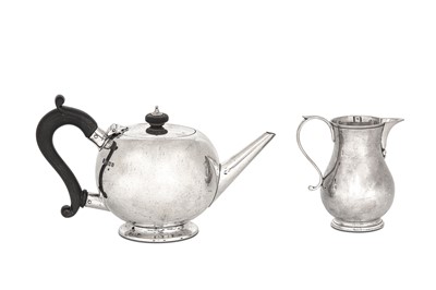 Lot 441 - A George V sterling silver bullet teapot,...