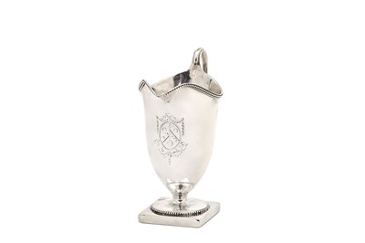 Lot 11 - A George III sterling silver helmet cream jug,...