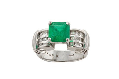 Lot 83 - An emerald and diamond ring The cut-cornered...