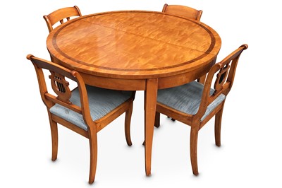 Lot 492 - A Biedermeier style satinwood D-end dining...