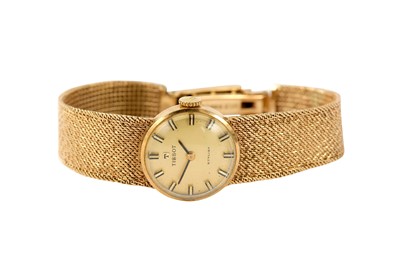 Lot 94 - TISSOT. A 9K YELLOW GOLD LADIES MANUAL...