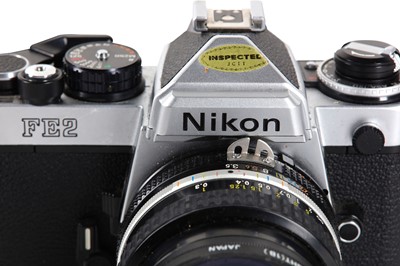 Lot 52 - A Nikon FE2 SLR Camera Outfit Serial No:...