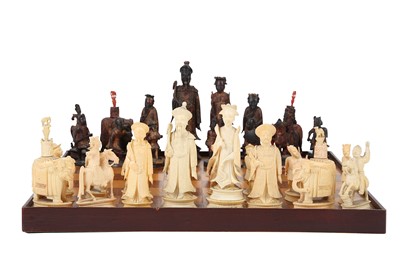 Lot 74 - A Chinese carved ivory chess set, one half...