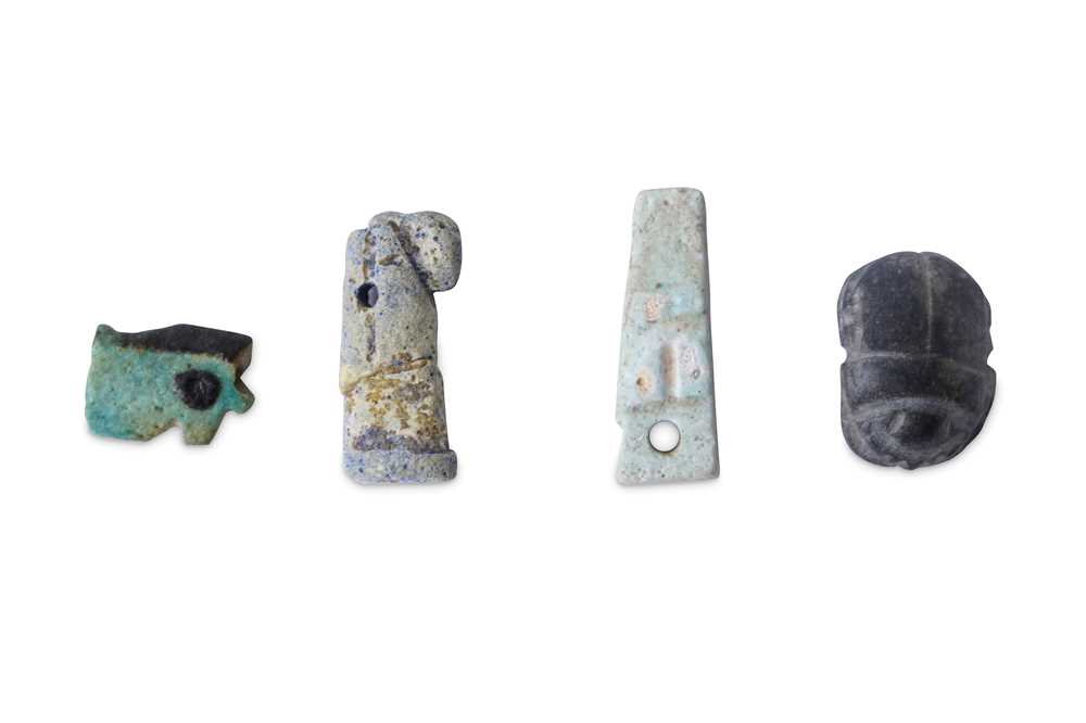 Lot 23 - A GROUP OF EGYPTIAN FRIT AMULETS Late Period,...