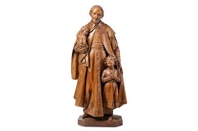 Lot 265 - A 19TH CENTURY SPANISH CARVED WALNUT FIGURAL...