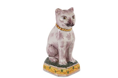 Lot 47 - An early 20th Century faience model of a cat...