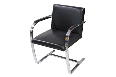 Lot 718 - A contemporary chromed steel cantilever chair...