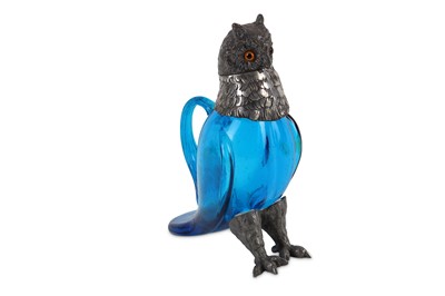 Lot 115 - A novelty owl claret jug modelled in standing...