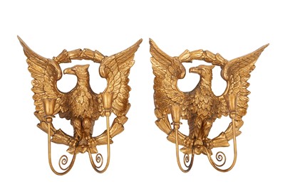 Lot 127 - A pair of Empire style giltwood twin branch...