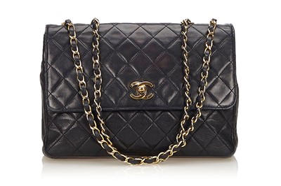 Lot 100 - Chanel Black Quilted Shoulder Bag, c. 1991-94,...