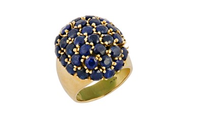 Lot 201 - A sapphire bombé ring Set throughout with...