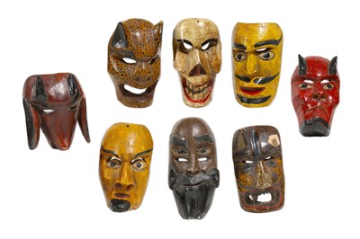 Lot 150 - A GROUP OF MEXICAN PAINTED WOOD MASKS The...