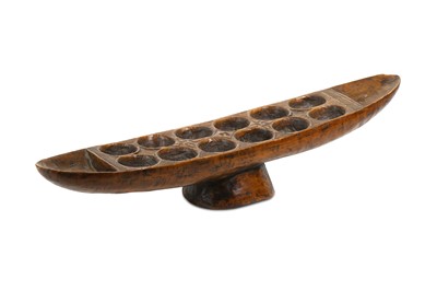 Lot 163 - A WEST AFRICAN BOAT SHAPED GAME BOARD For...