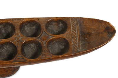 Lot 163 - A WEST AFRICAN BOAT SHAPED GAME BOARD For...