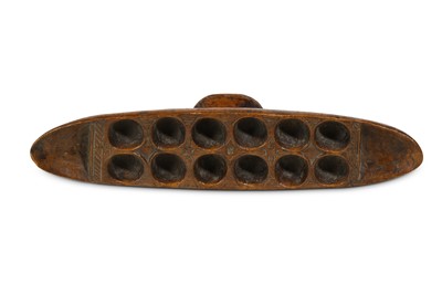 Lot 163 - A WEST AFRICAN BOAT SHAPED GAME BOARD For...