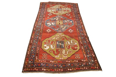 Lot 243 - An antique Chondzorek long rug, South Caucasus...